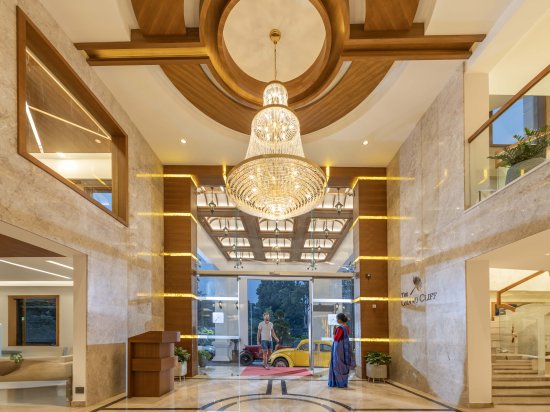 Main entrance with warm lighting, welcoming guests to a luxurious retreat.